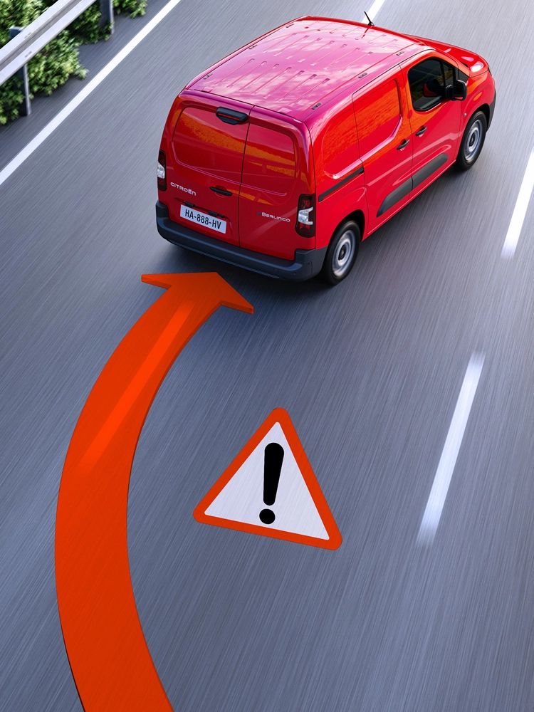 Vue arrière d’un Berlingo Van sortant de sa voie, avec alerte de franchissement de ligne affichée sur la chaussée.